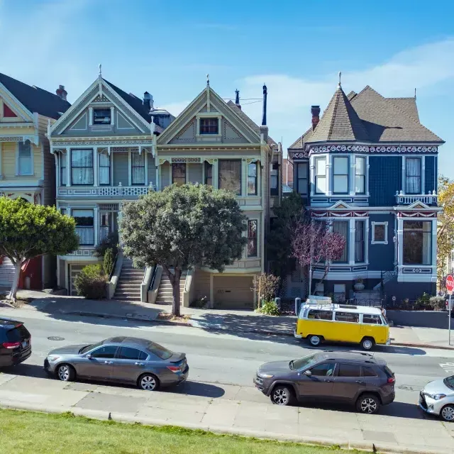 Cars parked in front of the Painted Ladies